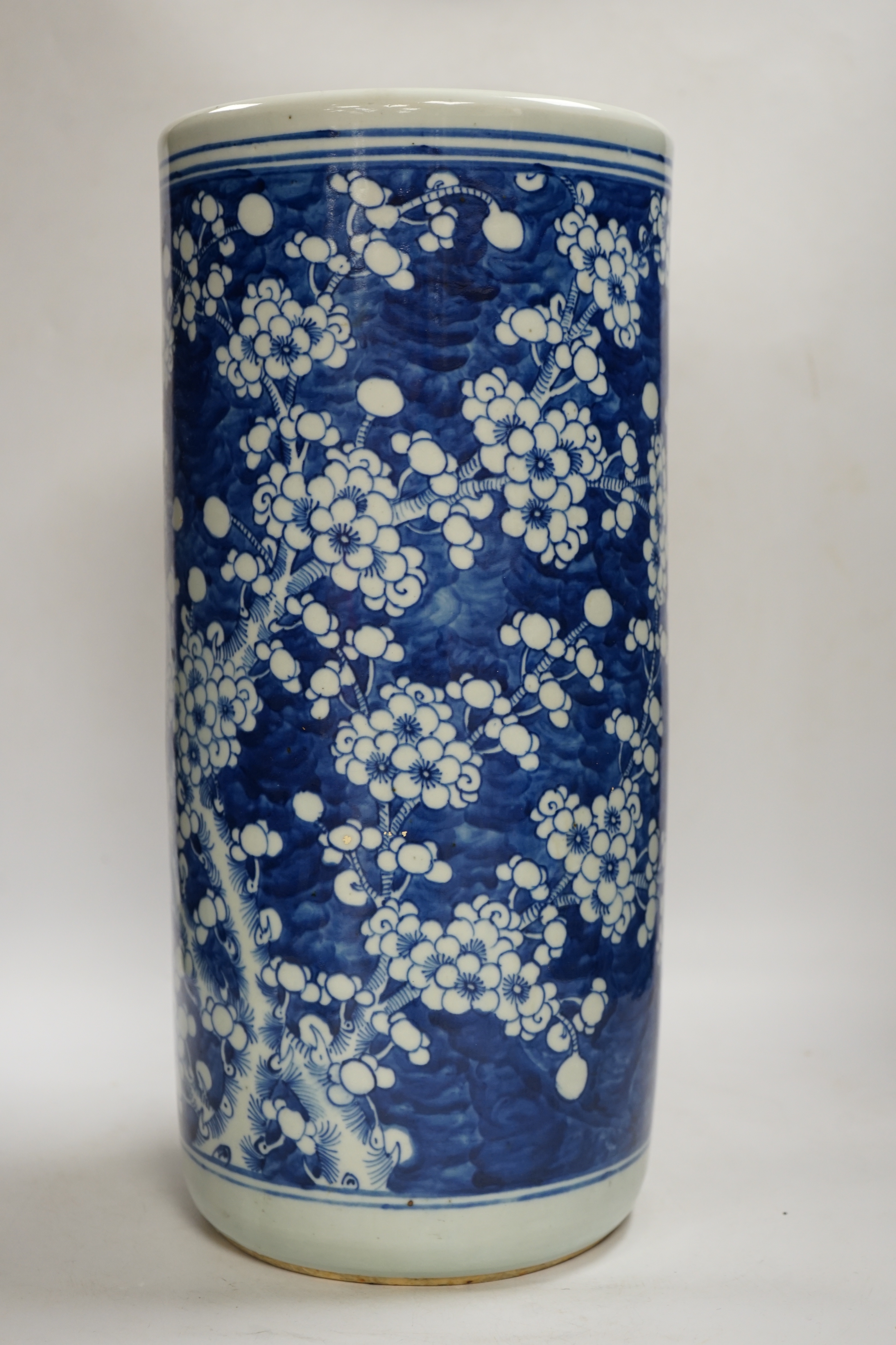 An early 20th century Chinese blue and white prunus stick stand, 44cm